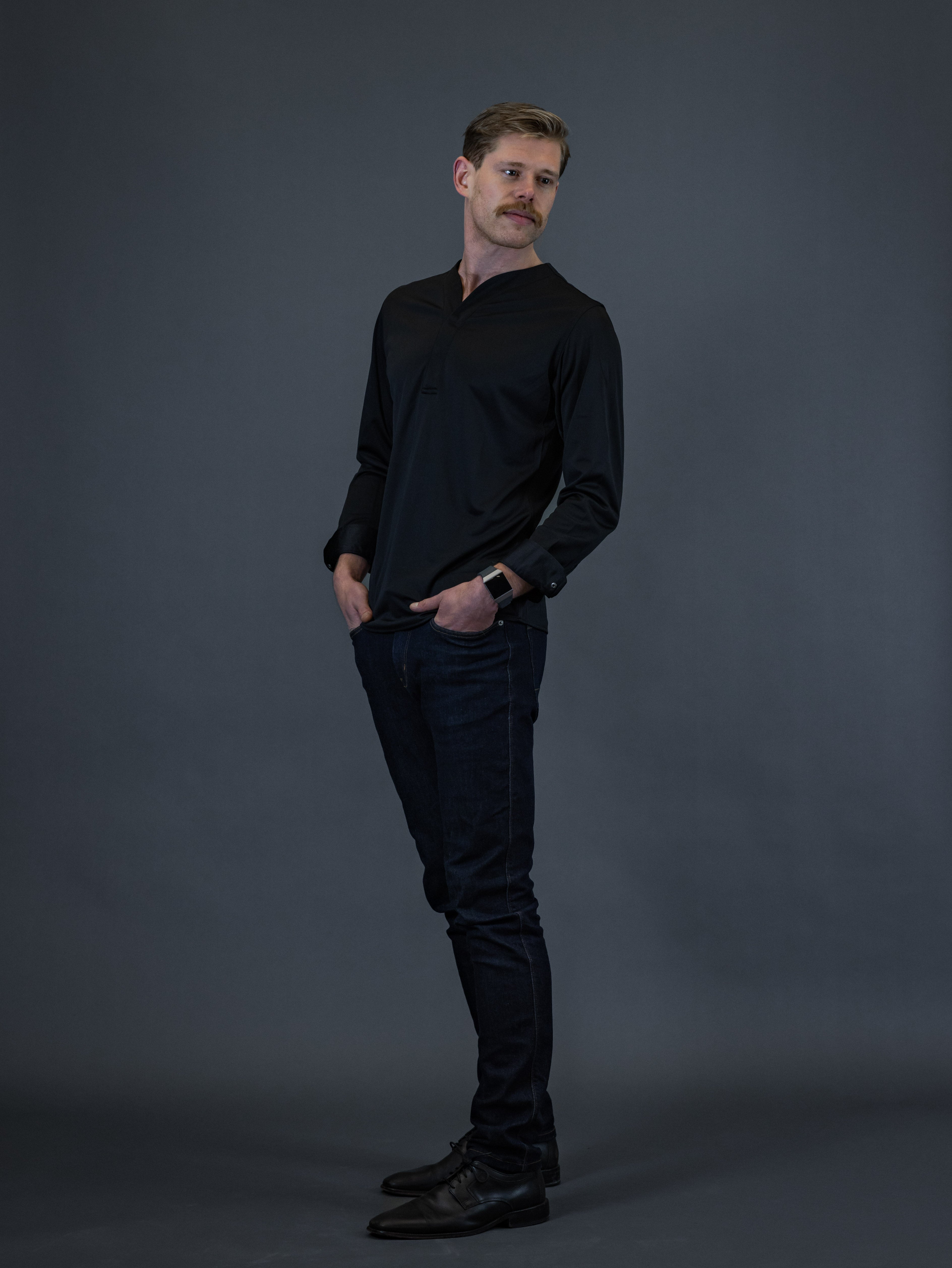 Man wearing mandarin collar shirt in black