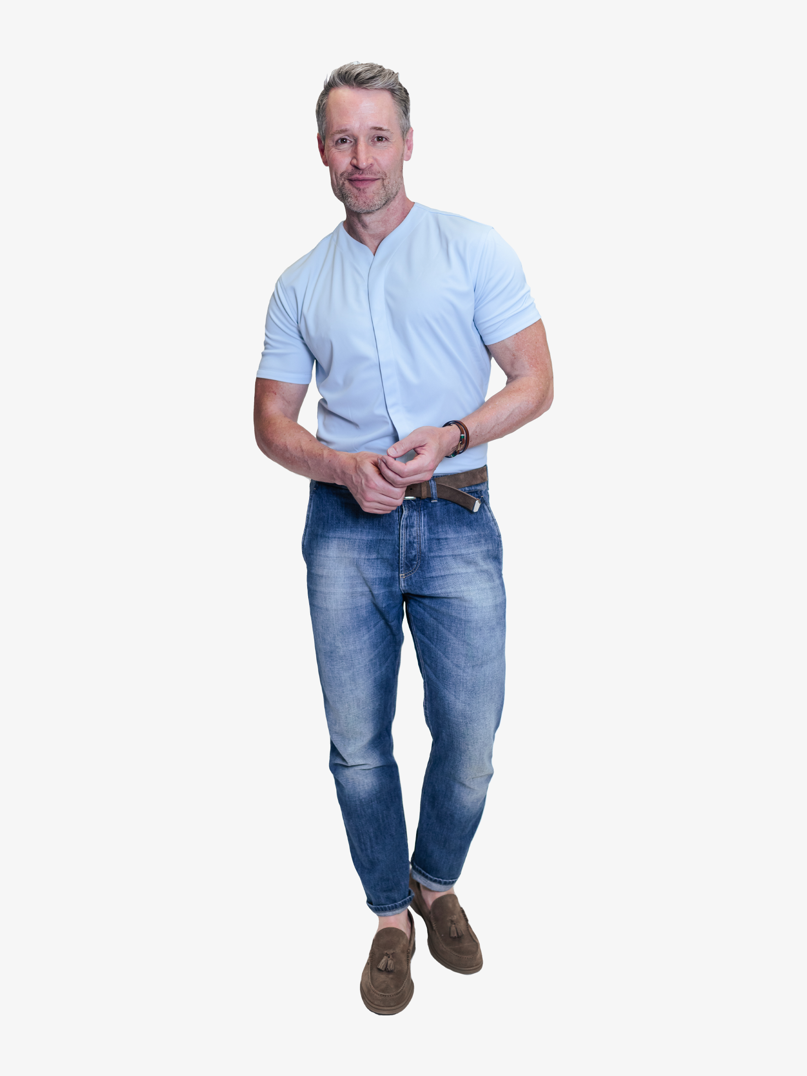 smiling model with fitted collarless short sleeve shirt in light blue with dark blue jeans and loafers