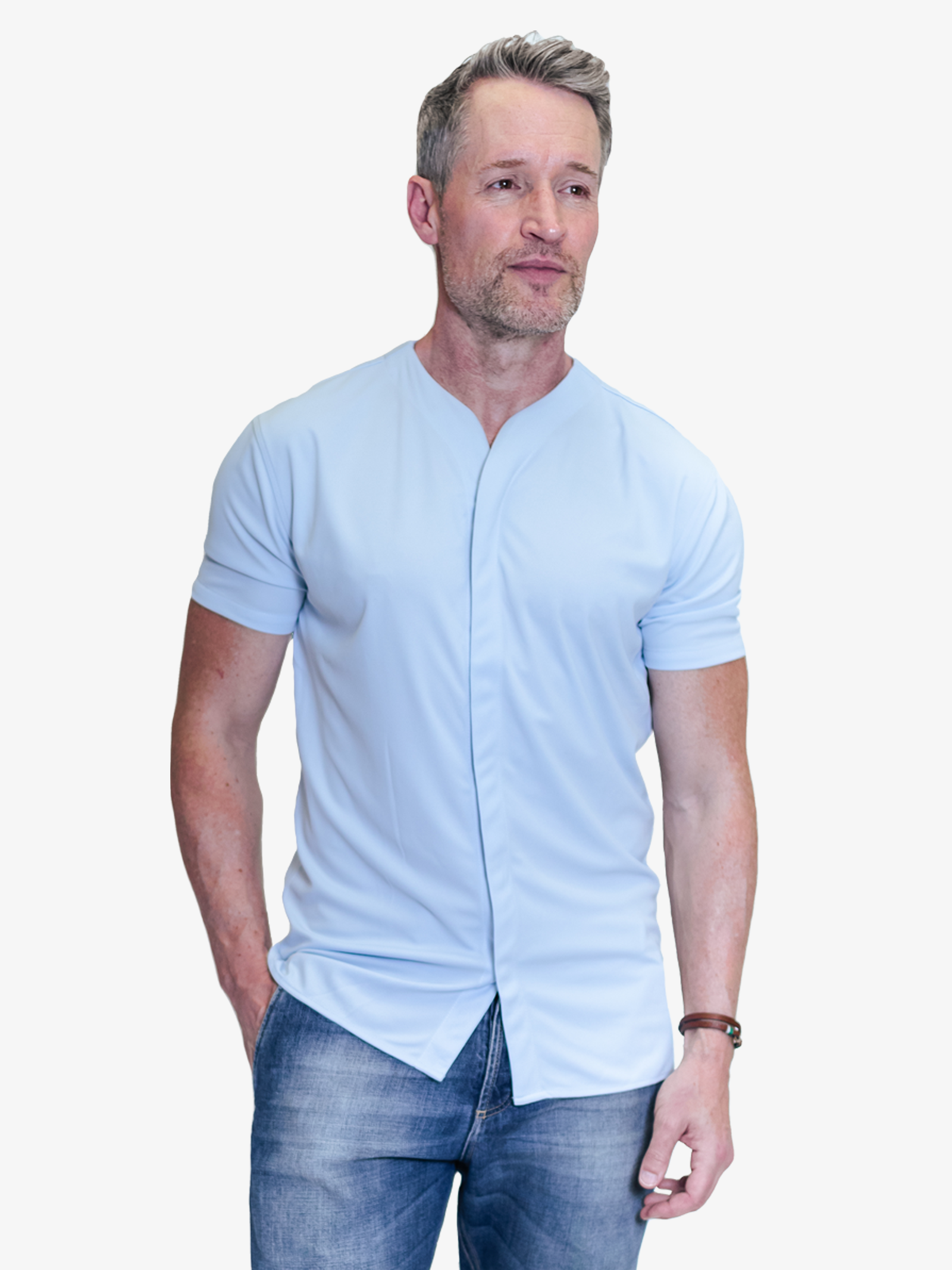 Model with fitted collarless short sleeve button down styled untucked with blue jeans