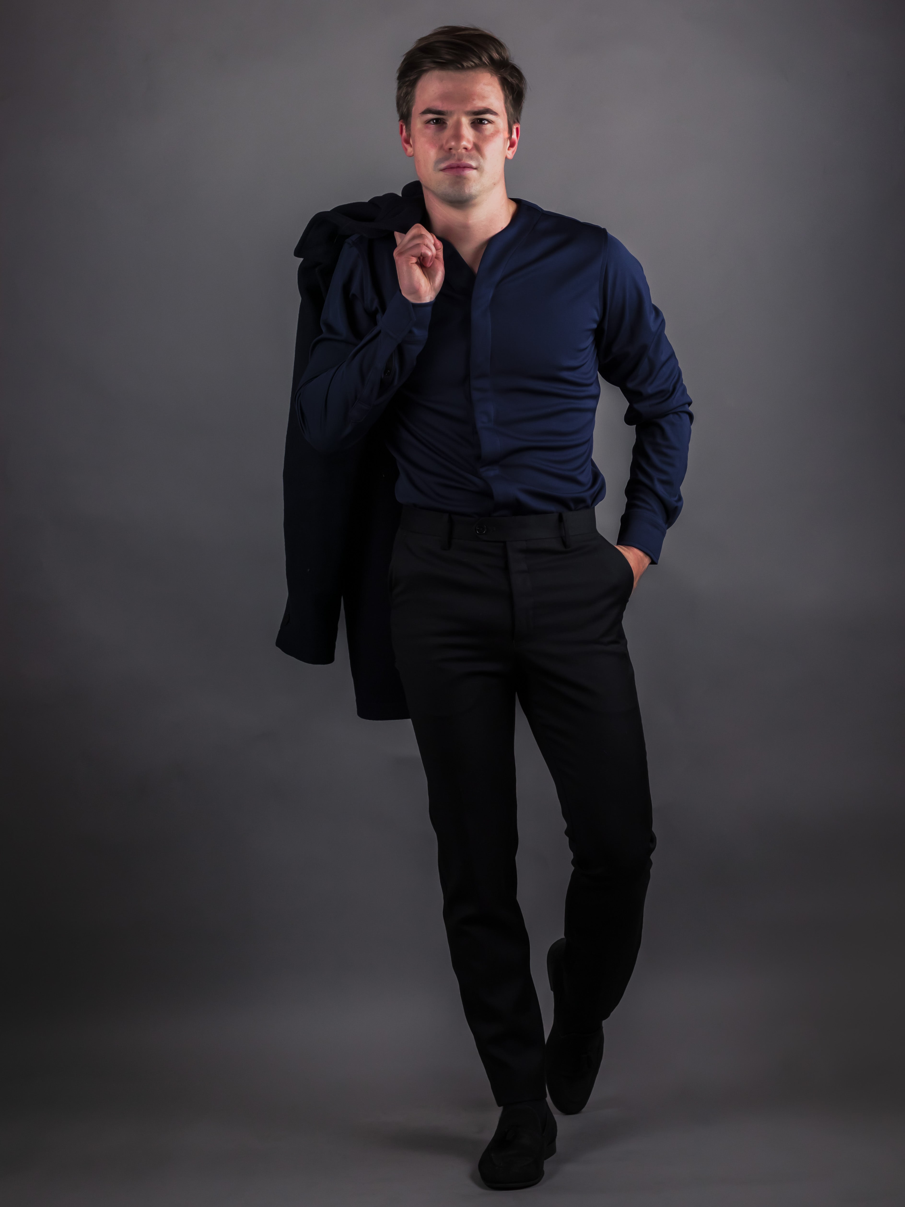 muscular model wearing navy blue collarless mens shirt made by Cheegs