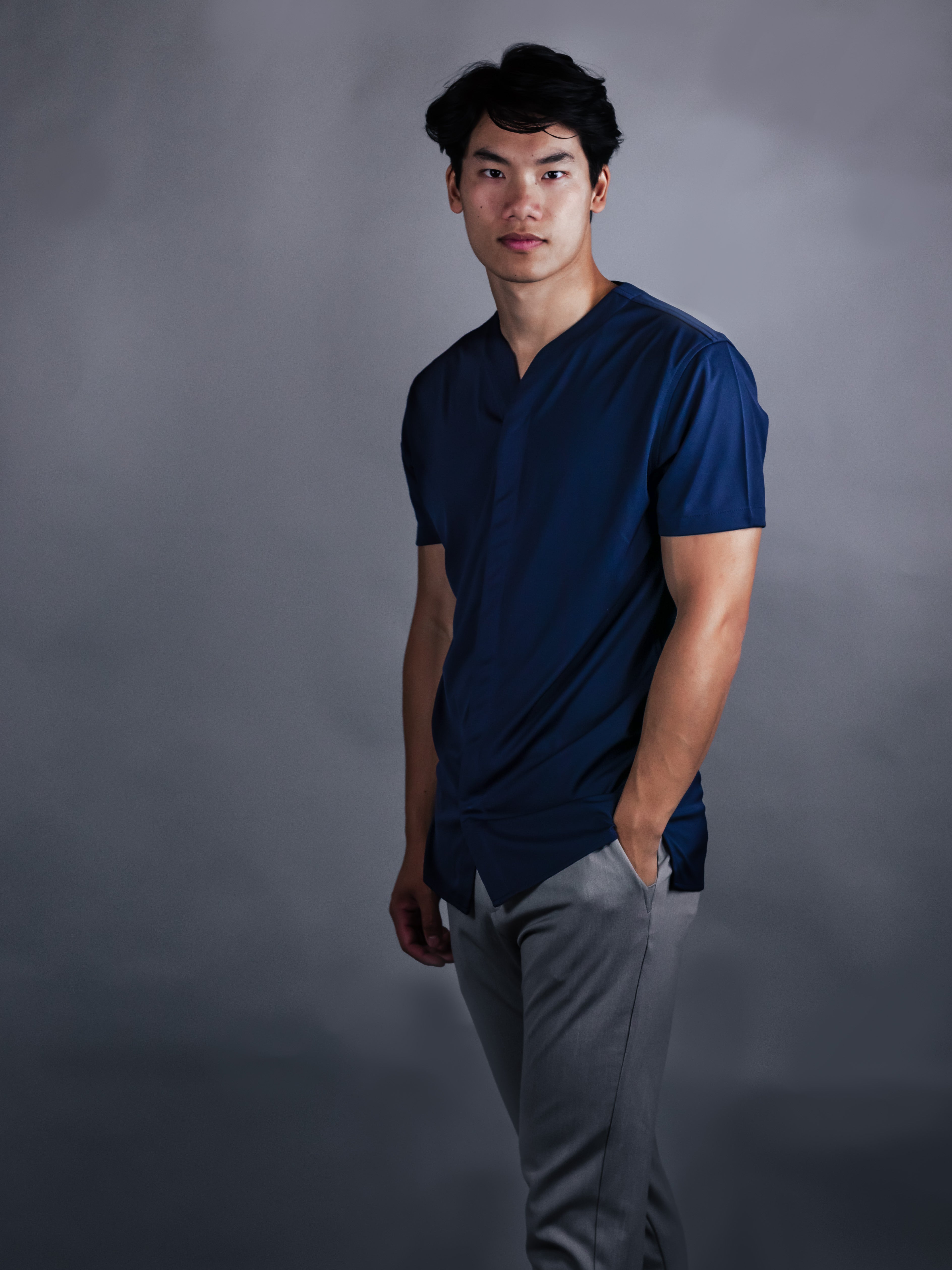 Young fit man wearing a modern Navy short sleeve dress shirt