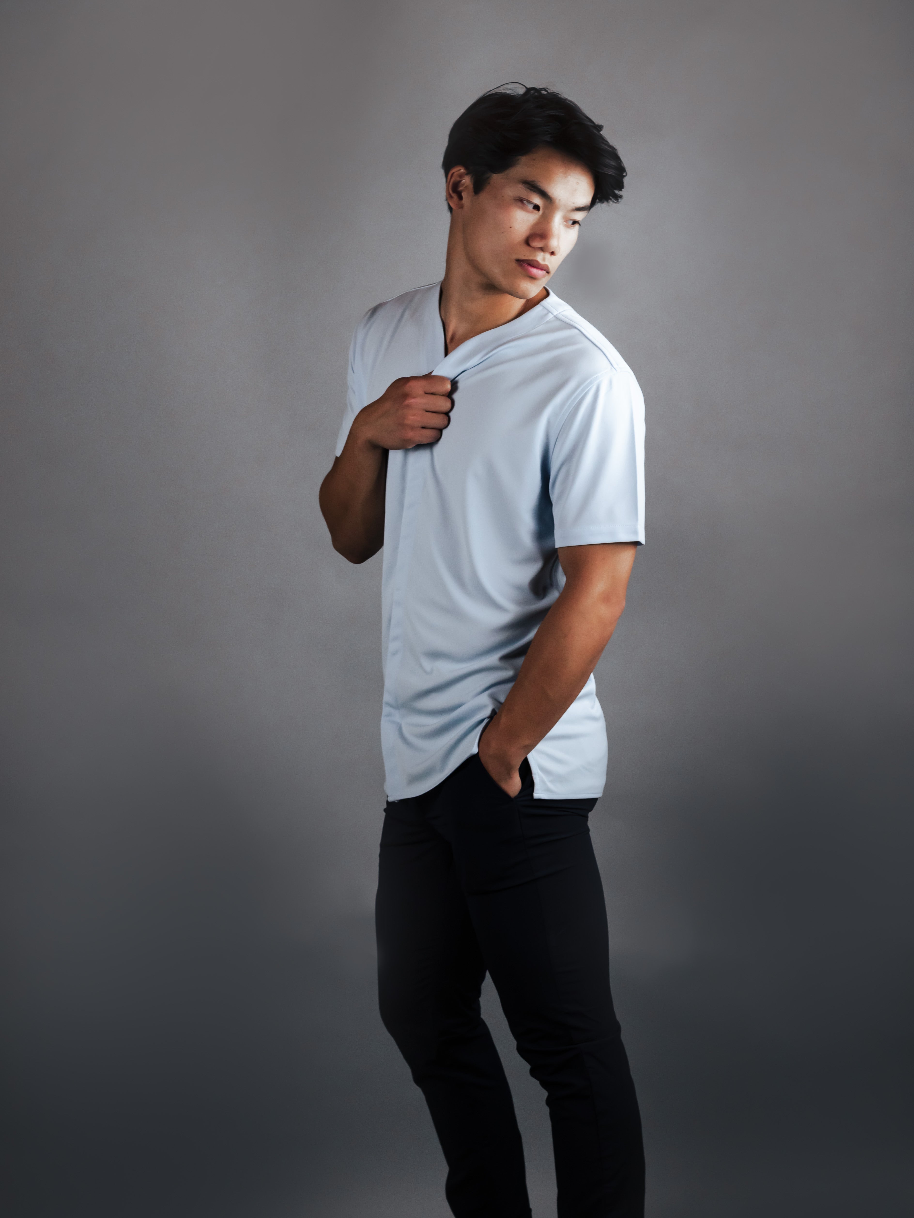 futurist model wearing a collarless mens dress shirt in with short sleeves