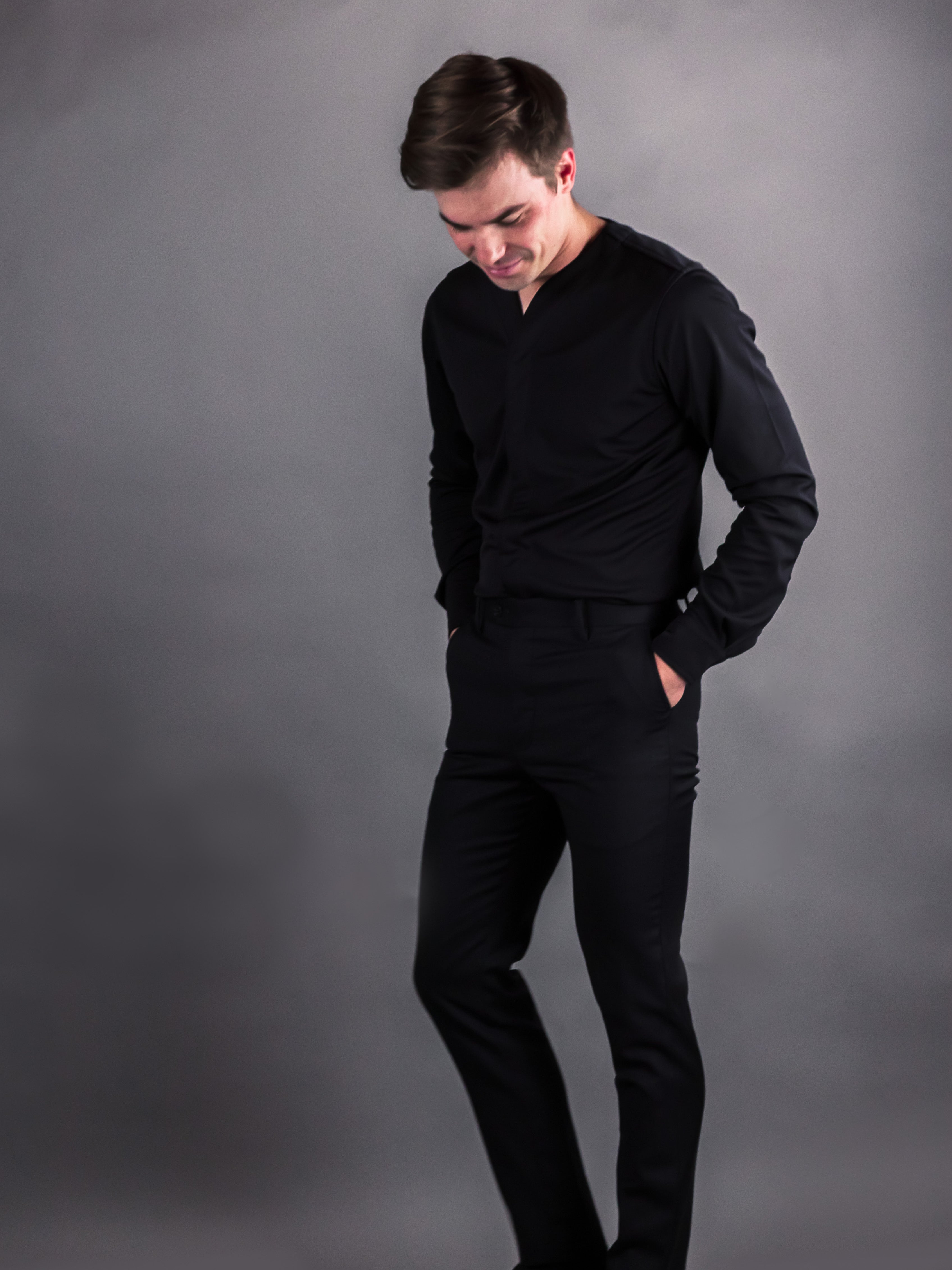 young man modeling the black casual dress shirt for men